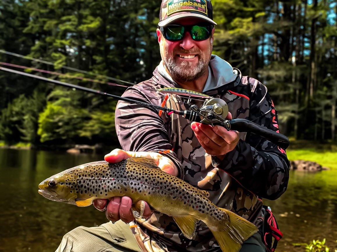 Angler with a brown trout caught on BFS fishing gear